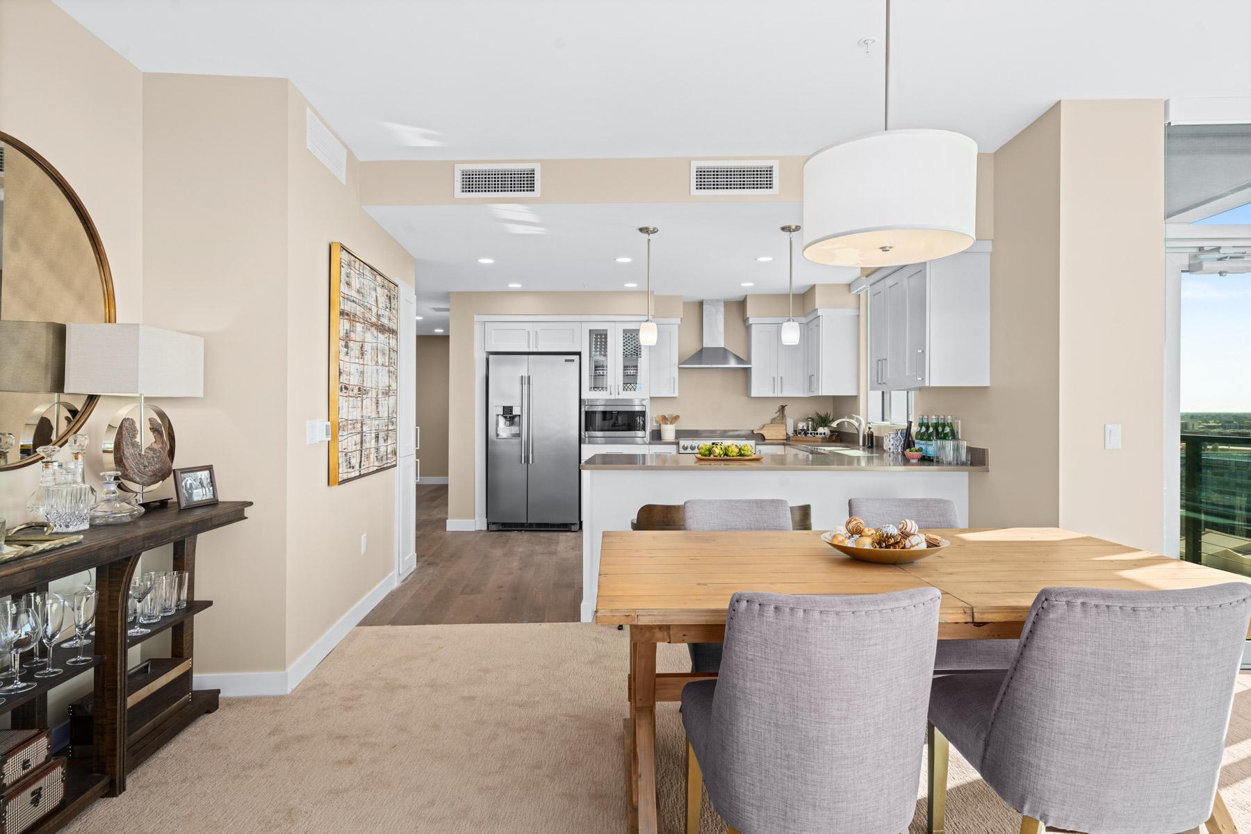 A kitchen and dining room in an Aspen II residence at Mirabella at ASU.