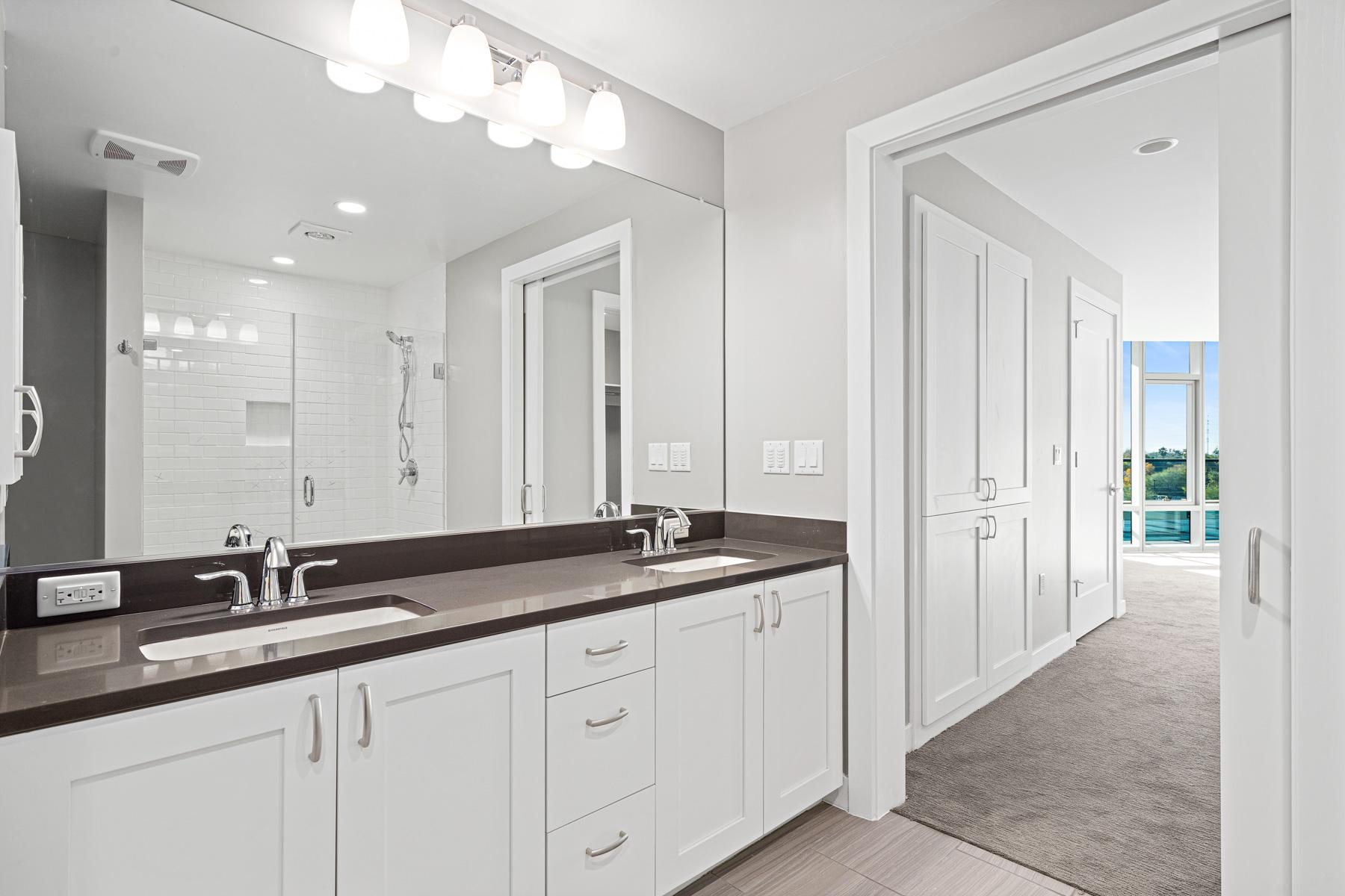 A bathroom with two sinks in a Mirabella at ASU residence.