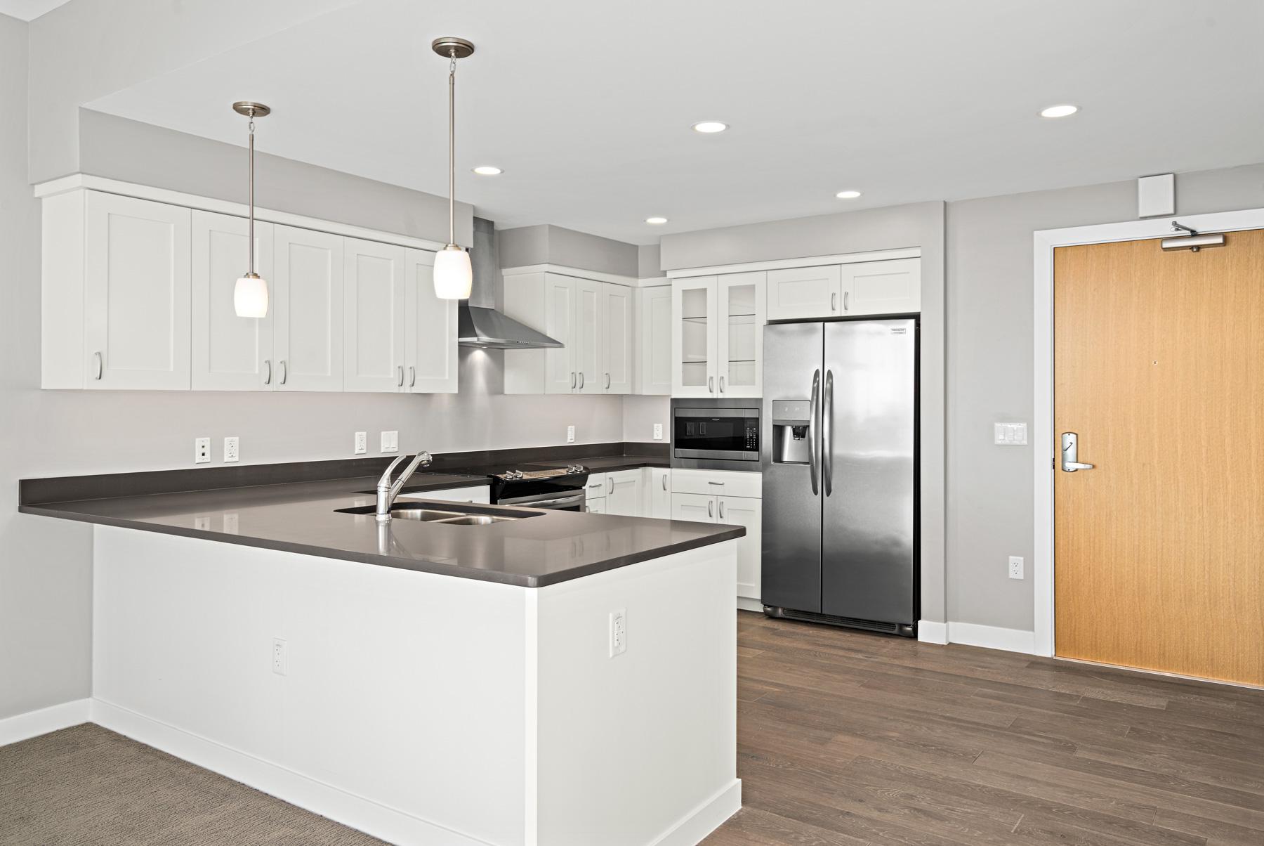 A kitchen with a breakfast bar in Palo Verde housing.