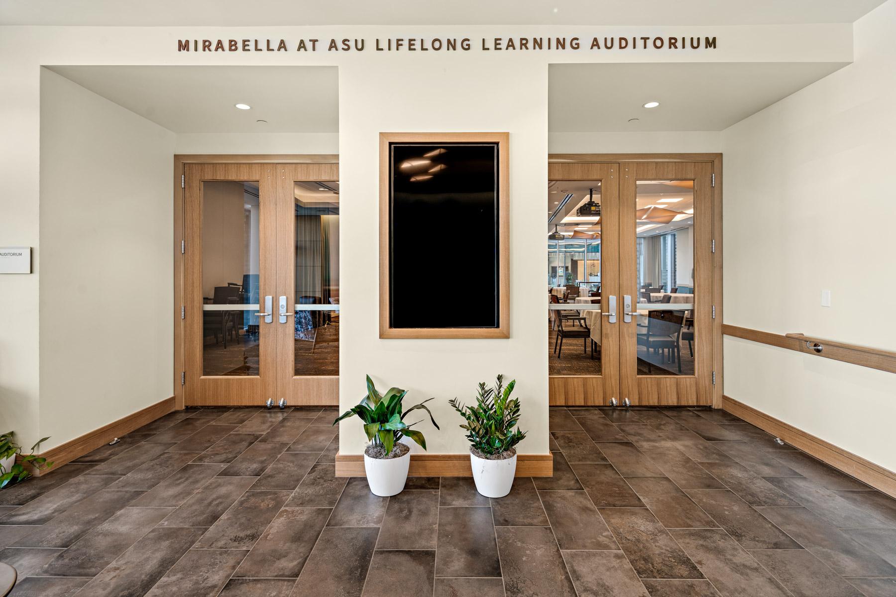 Mirabella at ASU auditorium entrance, with words reading Mirabella at ASU Lifelong Learning auditorium.