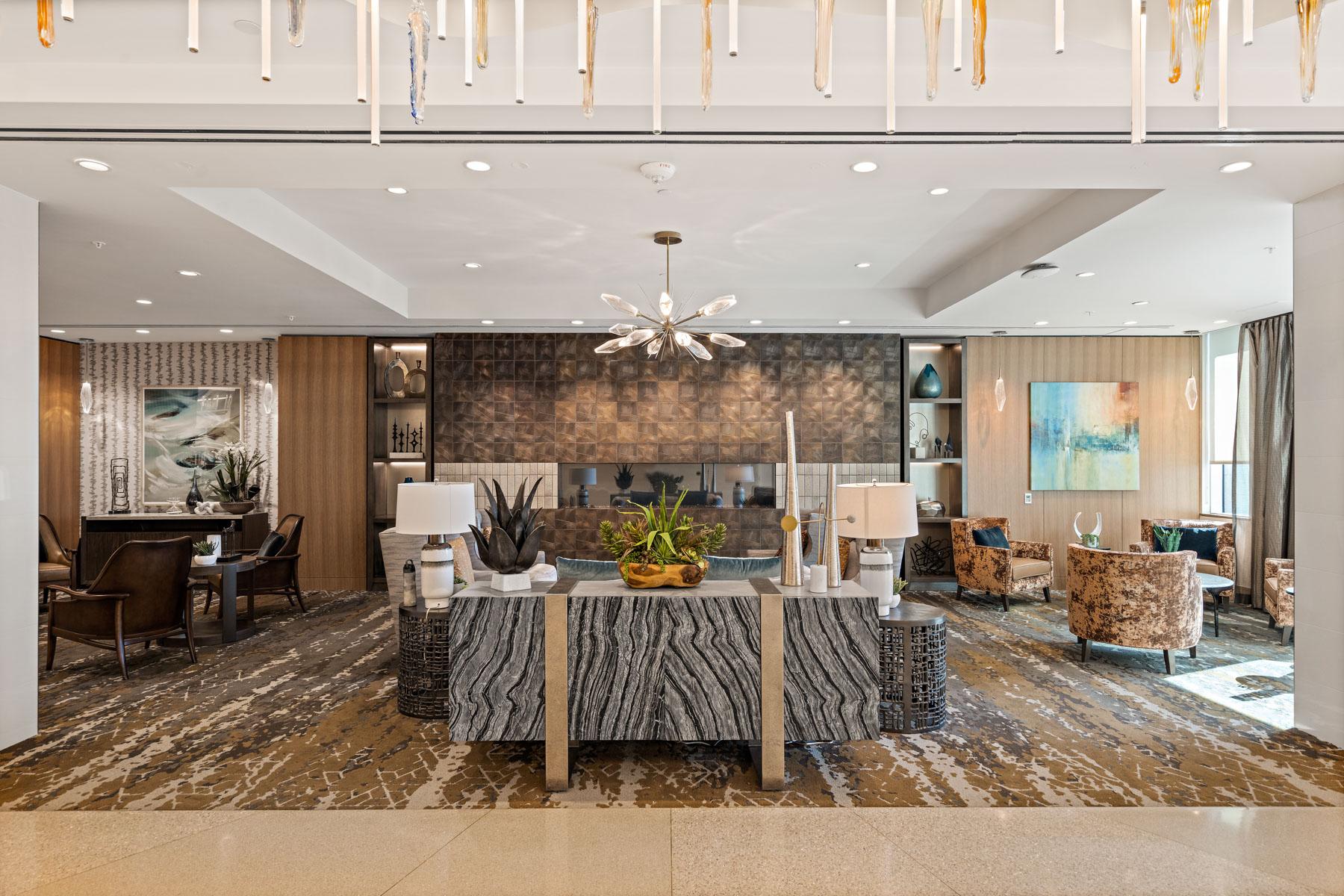 A lobby at Mirabella at ASU with comfortable chairs and decorative accents.